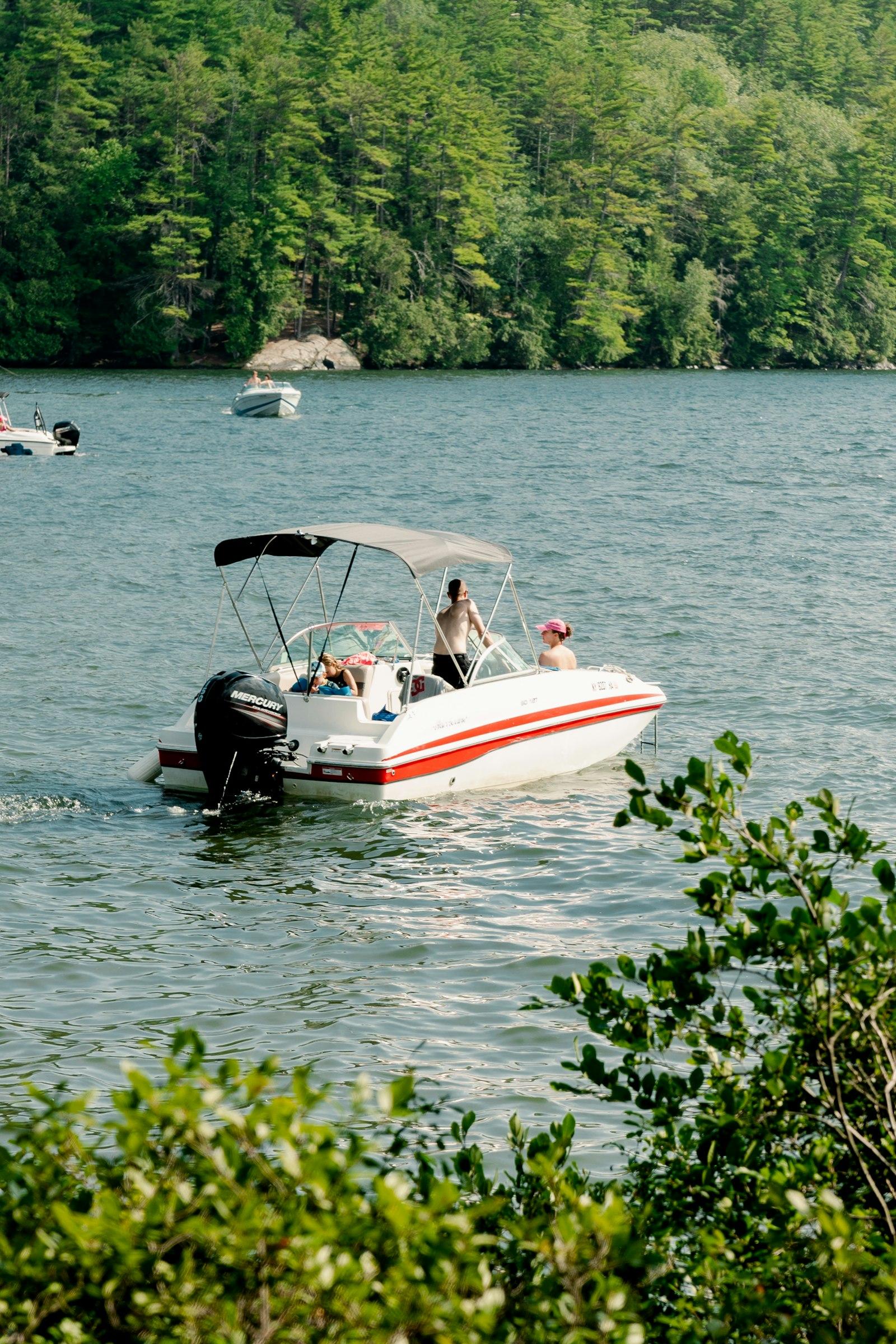 Group enjoying a pontoon boat on the water